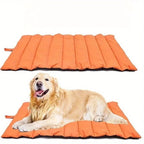 An orange inflatable pet mat shown both flat and with a golden retriever dog lying on it, against a plain white background.